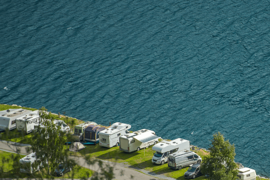 RV parked along on coast of a body of water