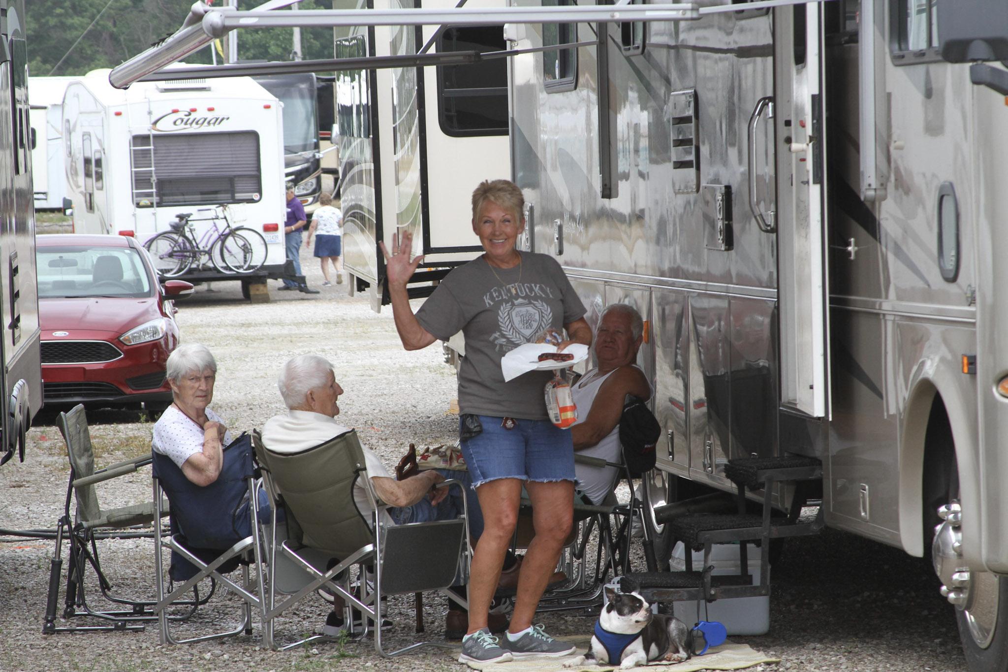 Women waving from outside RV